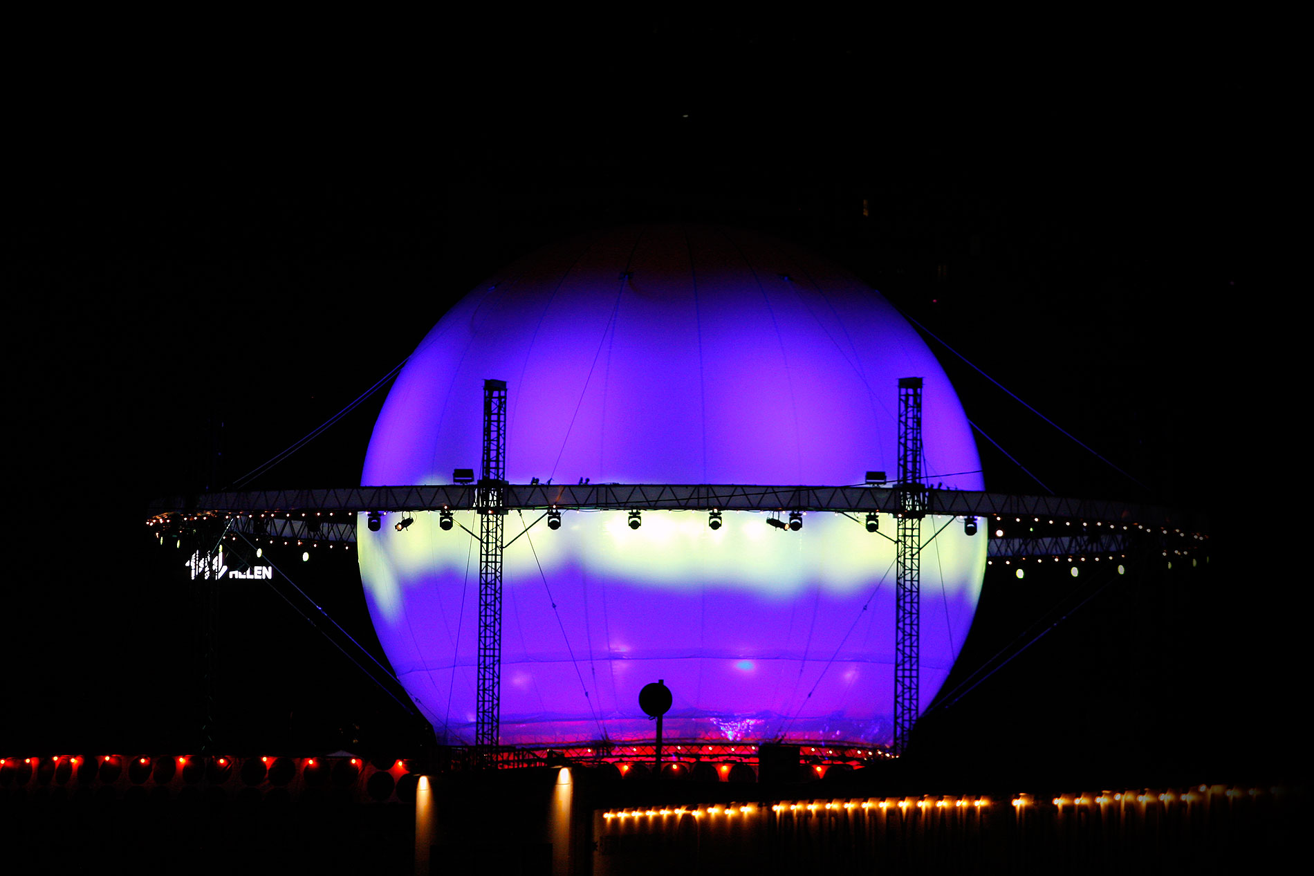 Drenched in the hues of soft light blue and purple, the glowing Balloon 360 stage looks like an otherworldly planet floating against the deepening dusk. Photograph: TONY ÖHBERG/FINLAND TODAY