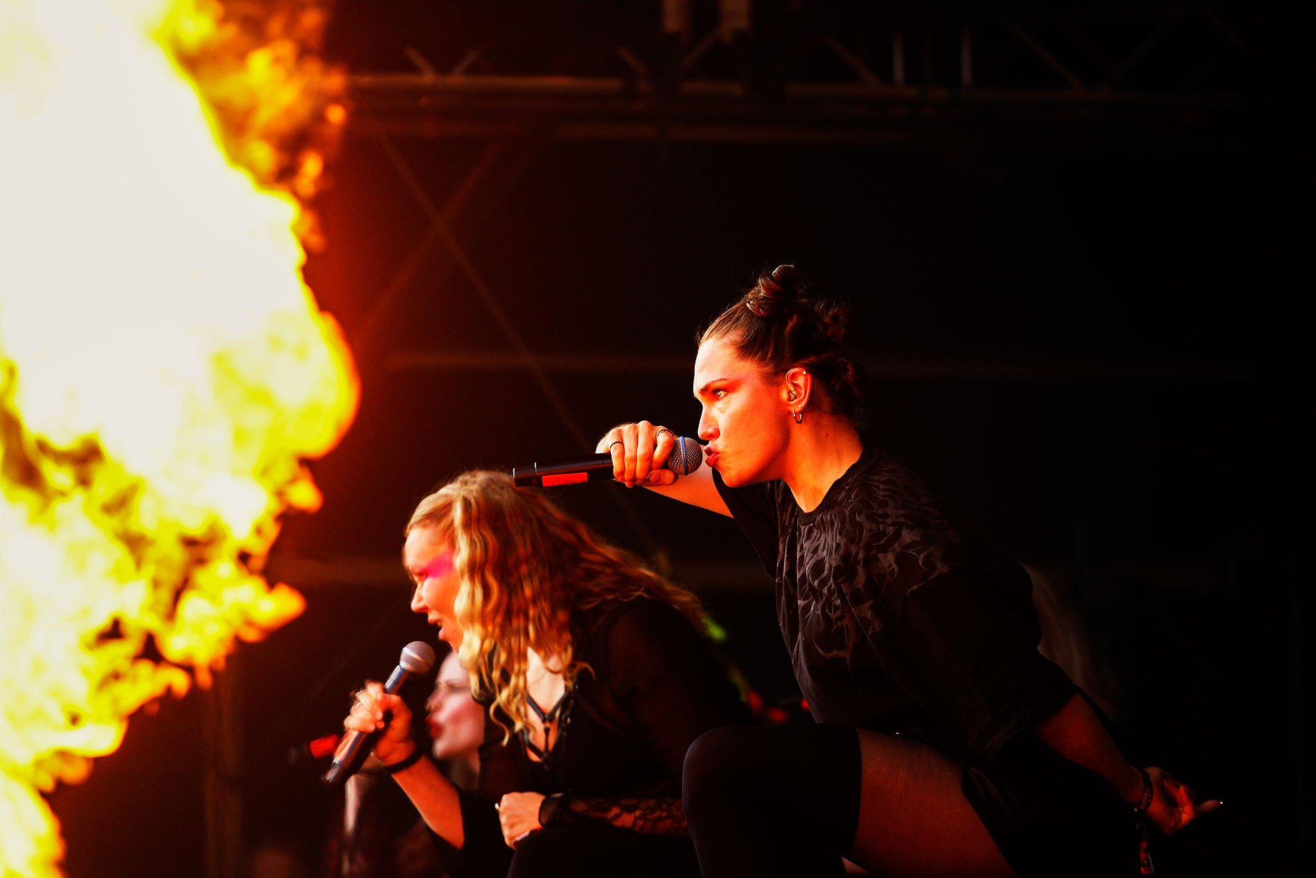 Tuuli Paju and Katariina Sorsa of IKINÄ singing straight through the flames at the Hellsinki Metal Festival on August 7, 2026. Photograph: TONY ÖHBERG/FINLAND TODAY