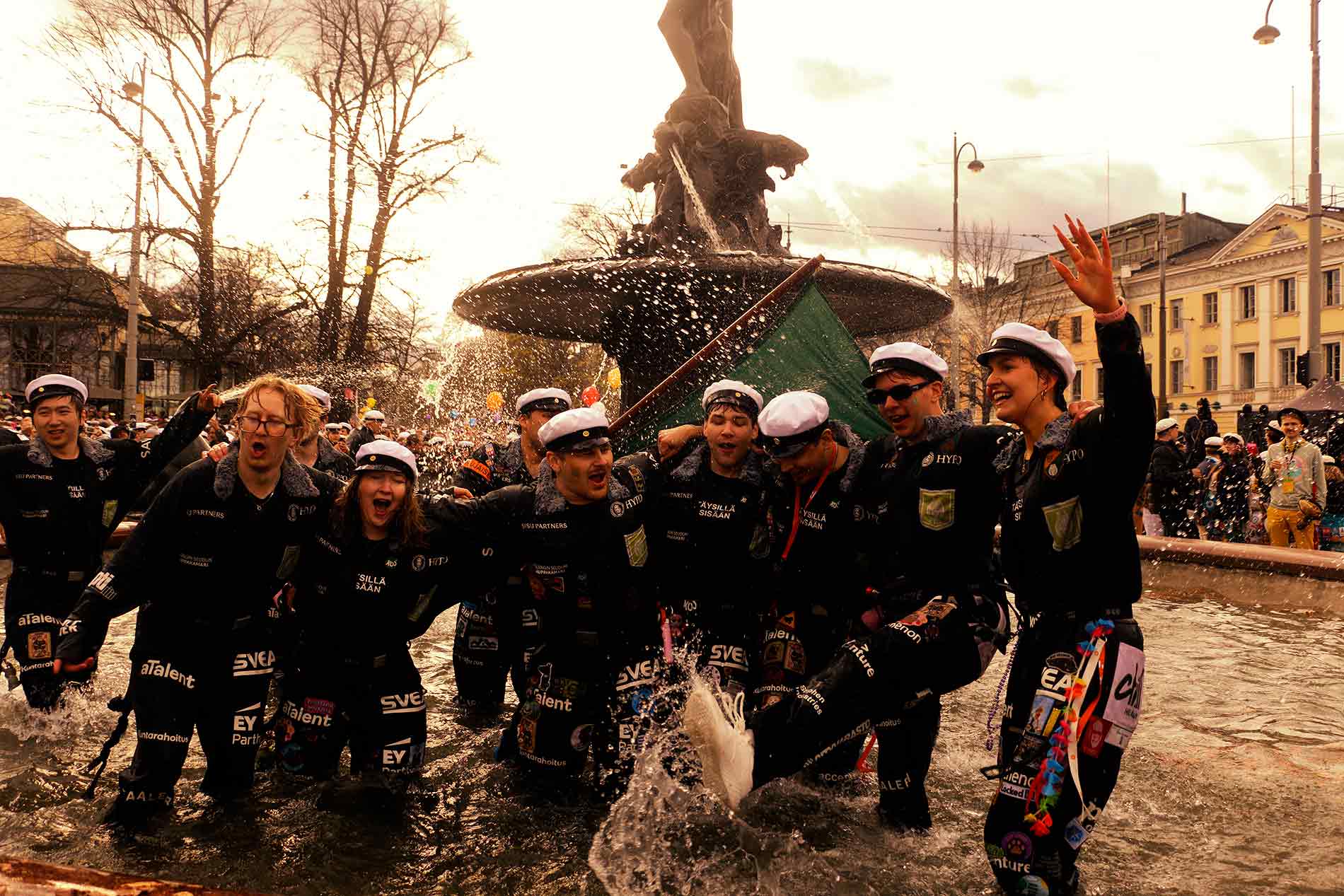 Manta Crew celebrates at the feet of Havis Amanda on May Day Eve, April 30, 2026, in Helsinki. Photograph by TONY ÖHBERG for FINLAND TODAY.